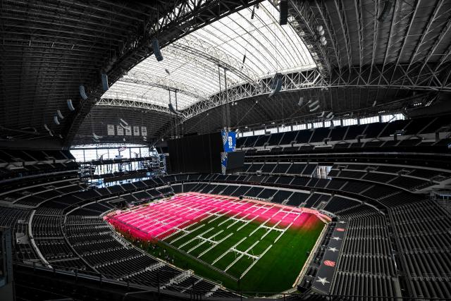 Dallas Stadium (temporarily renamed from AT&T Stadium for the 2026 FIFA World Cup) is seen with purple lights illuminating the field to promote grass growth, in Arlington, Texas, on May 14, 2026. (Photo by RONALDO SCHEMIDT / AFP)