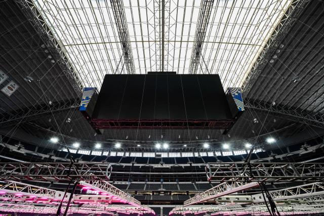Dallas Stadium (temporarily renamed from AT&T Stadium for the 2026 FIFA World Cup) is seen with purple lights illuminating the field to promote grass growth, in Arlington, Texas, on May 14, 2026. (Photo by RONALDO SCHEMIDT / AFP)