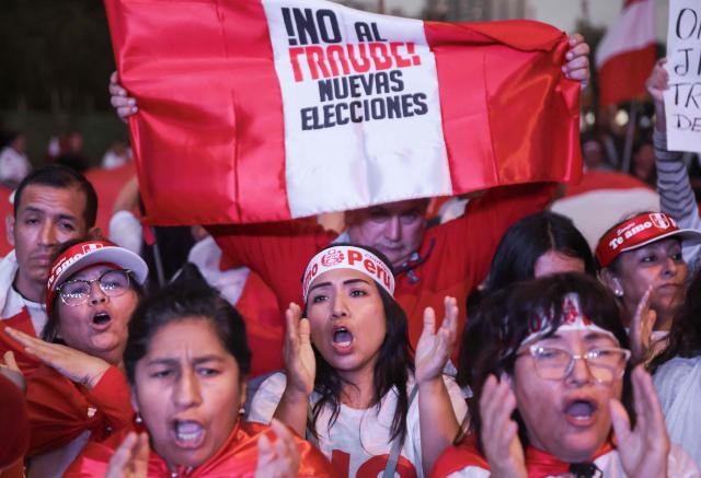 A supporter of Peru's presidential candidate for the Renovacion Popular party, Rafael Lopez Aliaga, shouts slogans during a rally to protest alleged irregularities in the recent elections in Lima on May 14, 2026. (Photo by Connie FRANCE / AFP)