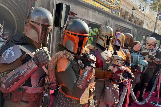 Cosplayers dressed as Mandalorians are seen at the world premiere of "Star Wars: The Mandalorian and Grogu" at the TCL Chinese Theatre in Los Angeles on May 14, 2026. (Photo by Chris DELMAS / AFP)