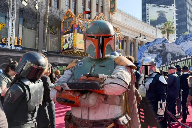Cosplayers dressed as Mandalorians are seen at the world premiere of "Star Wars: The Mandalorian and Grogu" at the TCL Chinese Theatre in Los Angeles on May 14, 2026. (Photo by Chris DELMAS / AFP)