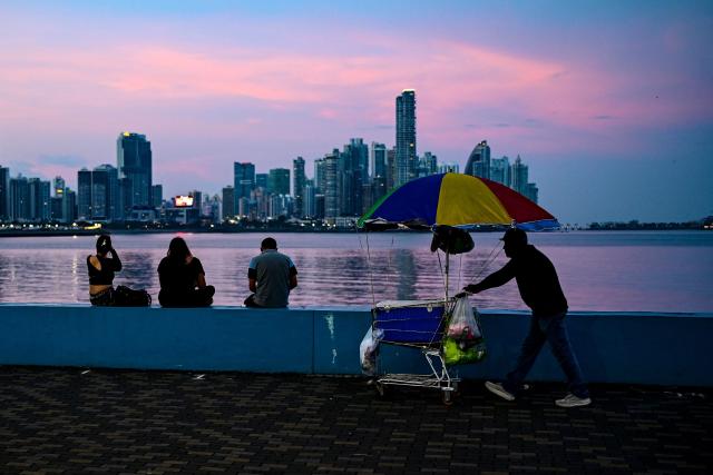 People hang out at Cinta Costera in Panama City on May 14, 2026. (Photo by Martin BERNETTI / AFP)