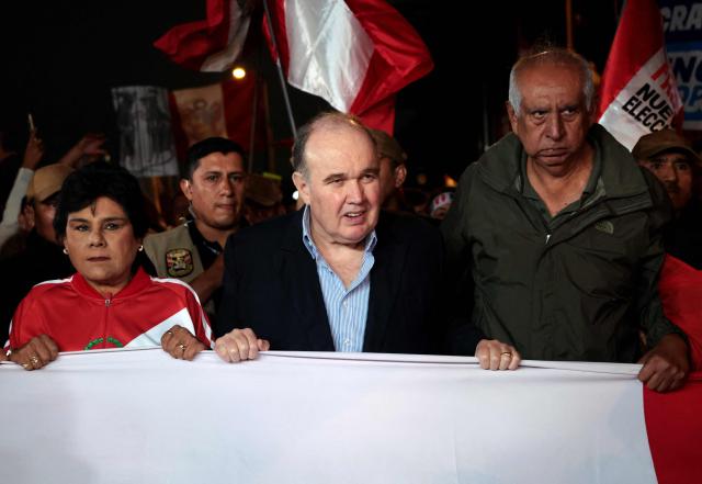 Peru's presidential candidate for the Renovacion Popular party, Rafael Lopez Aliaga, leads a rally to protest alleged irregularities in the recent elections in Lima on May 14, 2026. (Photo by Connie FRANCE / AFP)