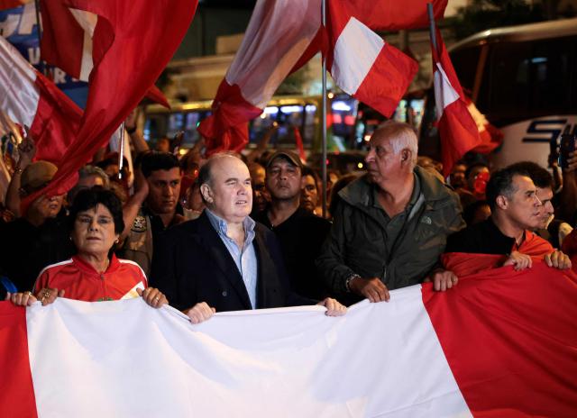 Peru's presidential candidate for the Renovacion Popular party, Rafael Lopez Aliaga, leads a rally to protest alleged irregularities in the recent elections in Lima on May 14, 2026. (Photo by Connie FRANCE / AFP)