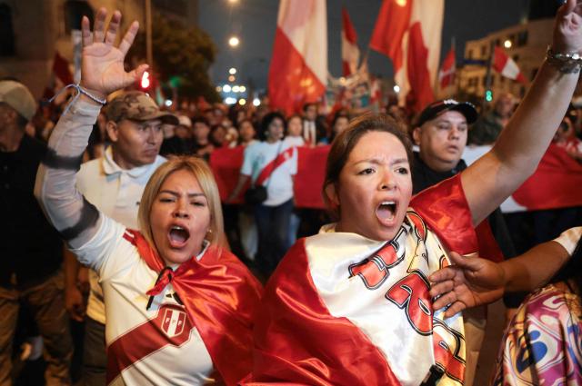 Supporters of Peru's presidential candidate for the Renovacion Popular party, Rafael Lopez Aliaga, shout slogans during a rally to protest alleged irregularities in the recent elections in Lima on May 14, 2026. (Photo by Connie FRANCE / AFP)
