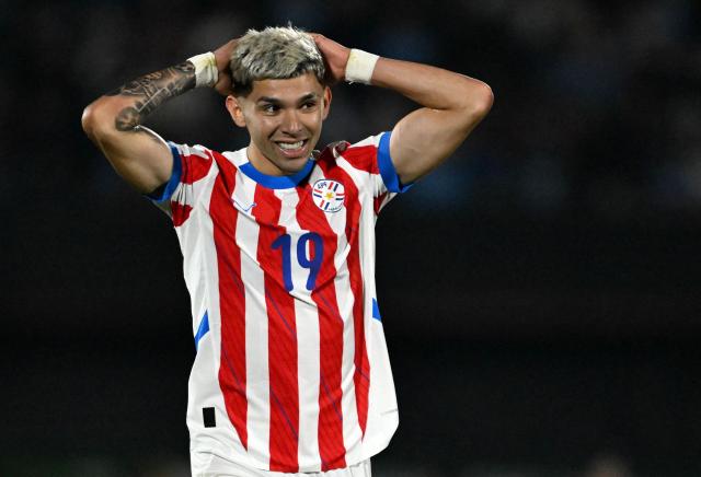 (FILES) Paraguay's forward Julio Enciso reacts to a missed chance during the 2026 FIFA World Cup South American qualifiers football match between Uruguay and Paraguay at the Centenario stadium in Montevideo, on September 6, 2024. Those who know him attest that Julio Enciso fears no challenges, nor does he ever lose touch with his roots. That "mita'i" (little boy)—who once spoke more Guaranн than Spanish—is today not only a 22-year-old man, but also Paraguay's hope for its return to the World Cup. (Photo by Eitan ABRAMOVICH / AFP)