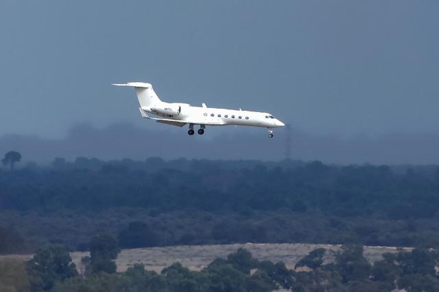 A plane carrying six passengers caught up in the MV Hondius hantavirus outbreak, lands at the Royal Australian Air Force (RAAF) Base Pearce, located north of the Western Australian city of Perth on May 15, 2026. (Photo by Antony DICKSON / AFP)