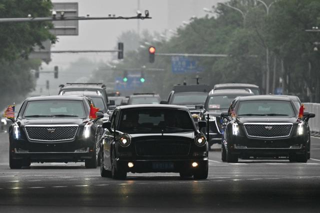 US President Donald Trump's motorcade heads to Zhongnanhai Garden in Beijing on May 15, 2026. (Photo by Pedro PARDO / AFP)