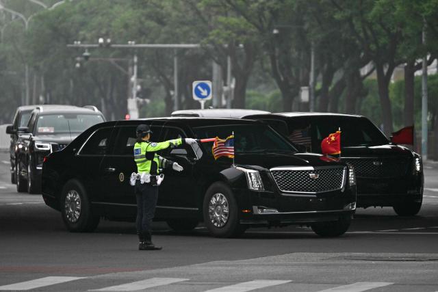 US President Donald Trump's motorcade heads to Zhongnanhai Garden in Beijing on May 15, 2026. (Photo by Pedro PARDO / AFP)