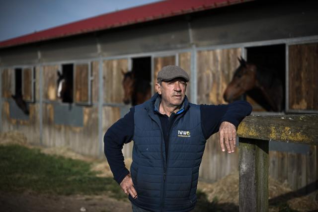 (FILES) French horse riding trainer Francois Nicolle poses before a training session in Saint-Augustin-sur-Mer, southwestern France, on May 3, 2022. François Nicolle, one of France's top three jump racing trainers, won the Grand Steeple-Chase de Paris in 2025 with his charge Diamond Carl, ridden by Clement Lefevbre. Based in Saint-Augustin at his private training centre, the Charente native works with his wife and a team of 40 staff to look after around a hundred horses. This year, he will attempt to double his success in this 6km marathon race featuring 23 obstacles. A man who thrives on a challenge, he hopes to win with the six-year-old Kentucky Wood. (Photo by Philippe LOPEZ / AFP)