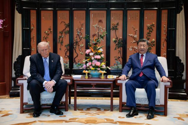 US President Donald Trump (L) meets with China’s President Xi Jinping on the sidelines of their visit to Zhongnanhai Garden in Beijing on May 15, 2026. (Photo by Evan Vucci / POOL / AFP)