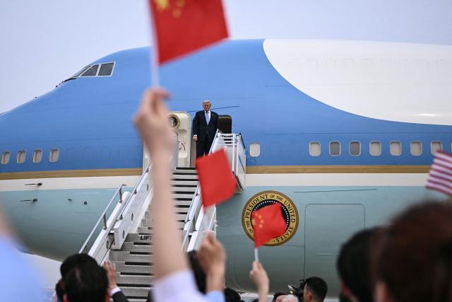 US President Donald Trump boards Air Force One before his departure from Beijing Capital Airport in Beijing on May 15, 2026. Trump said he had made "fantastic trade deals" with China's Xi Jinping, as the pair met on May 15 at final talks of a superpower summit that according to the US leader has also reaped a Chinese offer to help open the Strait of Hormuz. (Photo by Brendan SMIALOWSKI / AFP)