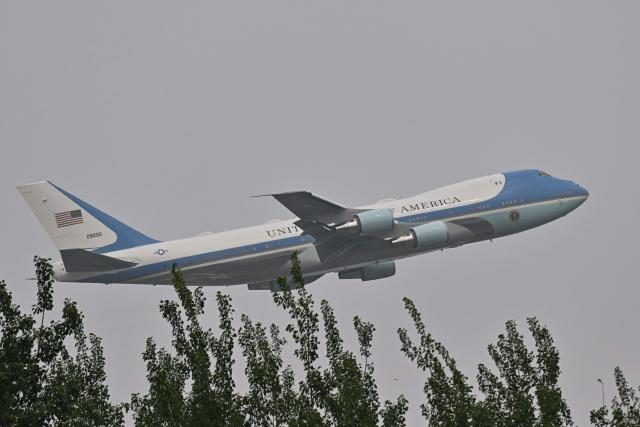 Air Force One, carrying US President Donald Trump, takes from Beijing Capital Airport in Beijing on May 15, 2026. Trump said he had made "fantastic trade deals" with China's Xi Jinping, as the pair met on May 15 at final talks of a superpower summit that according to the US leader has also reaped a Chinese offer to help open the Strait of Hormuz. (Photo by Pedro Pardo / AFP)