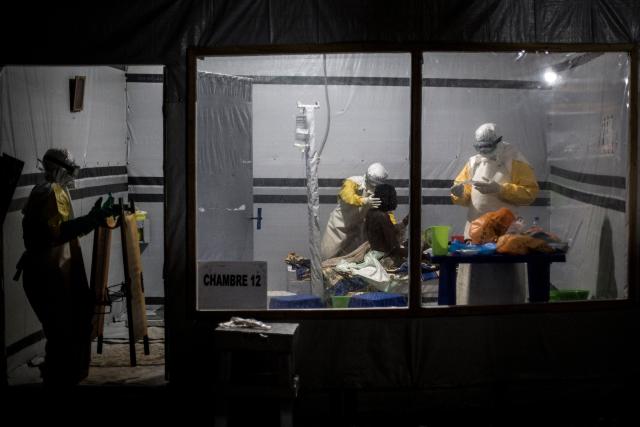 (FILES) Health workers treat an unconfirmed Ebola patient, inside a MSF (Doctors Without Borders) supported Ebola Treatment Centre (ETC) on November 3, 2018 in Butembo, Democratic Republic of the Congo. An outbreak of the ebola virus has been blamed for dozens of deaths in the east of the Democratic Republic of the Congo, African health authorities said on May 15, 2026.
The outbreak is in Ituri province. (Photo by John WESSELS / AFP)