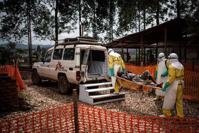 (FILES) Health workers move a patient to a hospital after he was cleared of having Ebola inside a MSF (Doctors Without Borders) supported Ebola Treatment Centre (ETC) on November 4, 2018 in Butembo, Democratic Republic of the Congo. An outbreak of the ebola virus has been blamed for dozens of deaths in the east of the Democratic Republic of the Congo, African health authorities said on May 15, 2026.
The outbreak is in Ituri province. (Photo by John WESSELS / AFP)