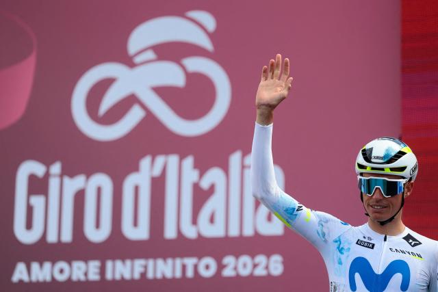Movistar Team Spanish rider Enric Mas waves during the presentation prior the 7th stage of the Giro d'Italia 2026 - Tour of Italy cycling race between Formia and Blockhaus, Italy, on May 15, 2026. (Photo by Luca Bettini / AFP)