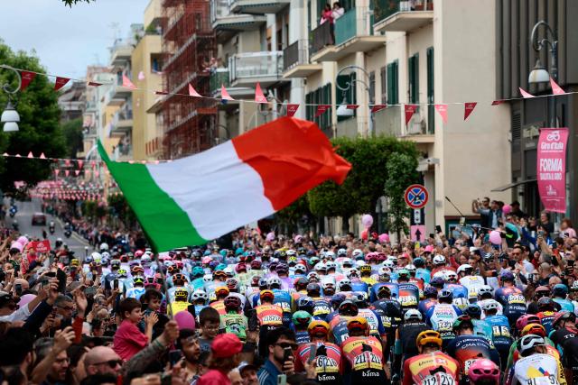 The pack rides to the start line of the 7th stage of the Giro d'Italia 2026 - Tour of Italy cycling race between Formia and Blockhaus, Italy, on May 15, 2026. (Photo by Luca Bettini / AFP)