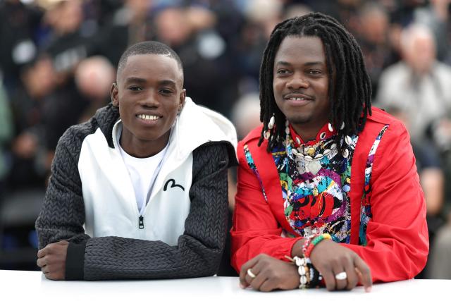 Central African Republic actor Bradley Fiomona Dembeasset (L) and Central African Republic director and screenwriter Rafiki Fariala pose during a photocall of the film "Congo Boy" at the 79th edition of the Cannes Film Festival in Cannes, southern France on May 15, 2026. (Photo by Sameer AL-DOUMY / AFP)