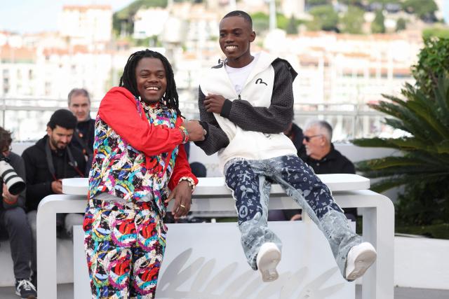 Central African Republic director and screenwriter Rafiki Fariala (L) and Central African Republic actor Bradley Fiomona Dembeasset pose during a photocall of the film "Congo Boy" at the 79th edition of the Cannes Film Festival in Cannes, southern France on May 15, 2026. (Photo by Valery HACHE / AFP)