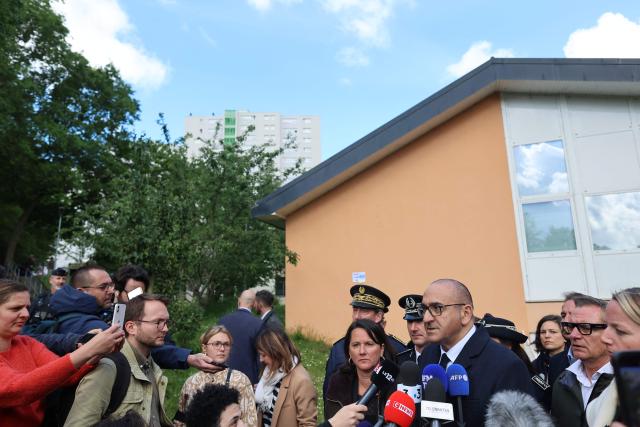 France's Interior Minister Laurent Nunez (C-R) next to Mayor of Nantes Johanna Rolland (C) addresses the press in the Port-Boyer neighbourhood in Nantes, western France, on May 15, 2026, a day after a shooting in a building of a residential complex killed a 15-year-old and injured two other minors. A teenager of about fifteen was shot and killed on the evening of May 14, and two other minors were wounded in a working-class neighborhood of Nantes, which had already been hit by deadly shootings linked to drug trafficking at the end of April. The shooting occurred around 7:30 p.m. in an apartment building, and the suspected shooters, who arrived on a motorcycle, fled the scene, according to multiple sources close to the investigation. The deceased teenager was shot in the heart, these sources confirmed. The two wounded teenagers, who were taken to the hospital, are not in life-threatening condition, according to a source close to the investigation. They are reportedly 13 and 14 years old. (Photo by FRED TANNEAU / AFP)