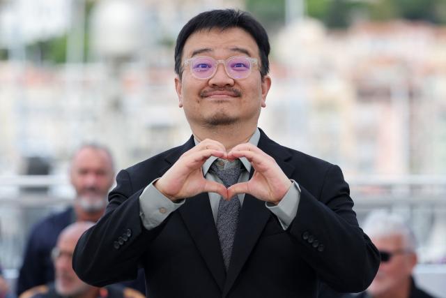 South Korean director Yeon Sang-Ho poses during a photocall of the film "Gun-Che" (Colony) at the 79th edition of the Cannes Film Festival in Cannes, southern France on May 15, 2026. (Photo by Thibaud MORITZ / AFP)