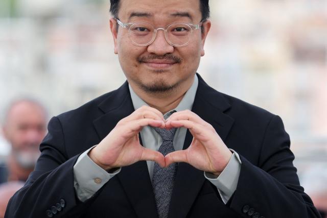 South Korean director Yeon Sang-Ho poses during a photocall of the film "Gun-Che" (Colony) at the 79th edition of the Cannes Film Festival in Cannes, southern France on May 15, 2026. (Photo by Thibaud MORITZ / AFP)