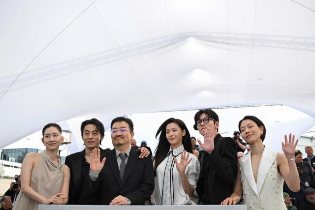 (From L) South Korean actress Shin Hyun-Been, South Korean actor Koo Kyo-Hwan, South Korean director Yeon Sang-Ho, South Korean actor Jun Ji-Hyun, South Korean actor Ji Chang-Wook and South Korean actress Kim Shin-Rock pose during a photocall of the film "Gun-Che" (Colony) at the 79th edition of the Cannes Film Festival in Cannes, southern France on May 15, 2026. (Photo by Olivier CHASSIGNOLE / AFP)