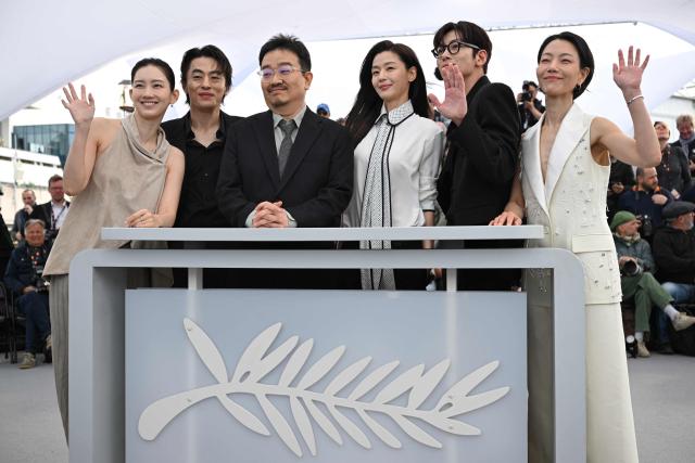 (From L) South Korean actress Shin Hyun-Been, South Korean actor Koo Kyo-Hwan, South Korean director Yeon Sang-Ho, South Korean actor Jun Ji-Hyun, South Korean actor Ji Chang-Wook and South Korean actress Kim Shin-Rock pose during a photocall of the film "Gun-Che" (Colony) at the 79th edition of the Cannes Film Festival in Cannes, southern France on May 15, 2026. (Photo by Olivier CHASSIGNOLE / AFP)