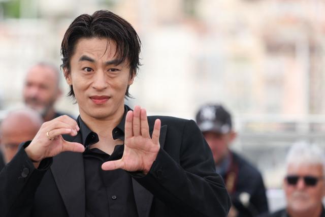 Guest and South Korean actor Koo Kyo-Hwan poses during a photocall of the film "Gun-Che" (Colony) at the 79th edition of the Cannes Film Festival in Cannes, southern France on May 15, 2026. (Photo by Thibaud MORITZ / AFP)