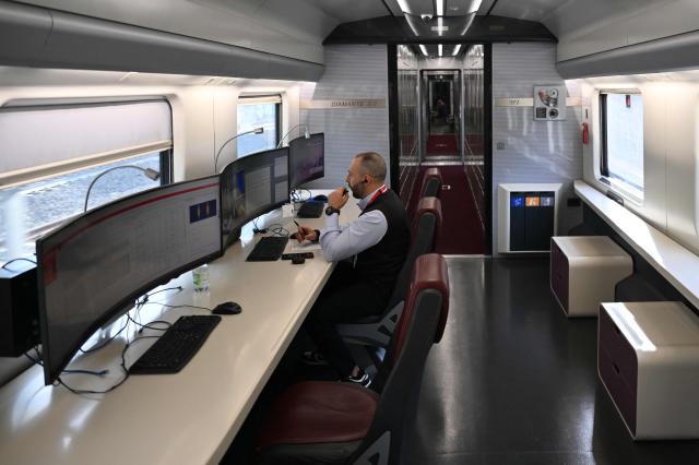 A technician works aboard a diagnostic train named Diamante 2.0 which reaches a speed of 300 km/h and inspects high-speed lines, in Naples trains station on May 15, 2026. Diamante 2.0 is a train in the Rete Ferroviaria Italiana (RFI) fleet; the special train uses 98 cameras and over 200 sensors placed on the roof and on the trolleys near the wheels to monitor over 500 parameters to collect data on the infrastructure, useful for promptly eliminating possible causes of anomalies and for supporting the scheduling and planning of maintenance operations to be carried out. (Photo by Alberto PIZZOLI / AFP)