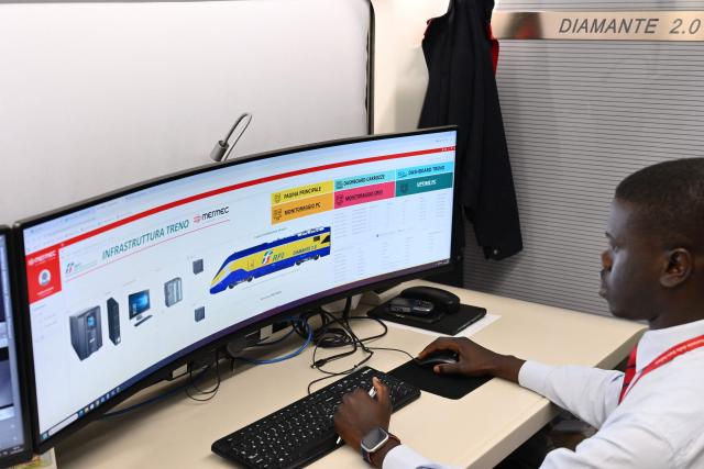 A technician works aboard a diagnostic train named Diamante 2.0 which reaches a speed of 300 km/h and inspects high-speed lines, in Naples trains station on May 15, 2026. Diamante 2.0 is a train in the Rete Ferroviaria Italiana (RFI) fleet; the special train uses 98 cameras and over 200 sensors placed on the roof and on the trolleys near the wheels to monitor over 500 parameters to collect data on the infrastructure, useful for promptly eliminating possible causes of anomalies and for supporting the scheduling and planning of maintenance operations to be carried out. (Photo by Alberto PIZZOLI / AFP)