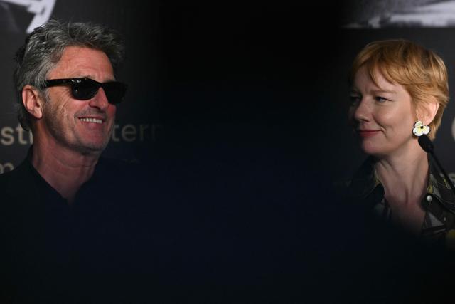Polish director and screenwriter Pawel Pawlikowski and German actress Sandra Huller attend a press conference for the film "Fatherland" at the 79th edition of the Cannes Film Festival in Cannes, southern France on May 15, 2026. (Photo by Julie SEBADELHA / AFP)