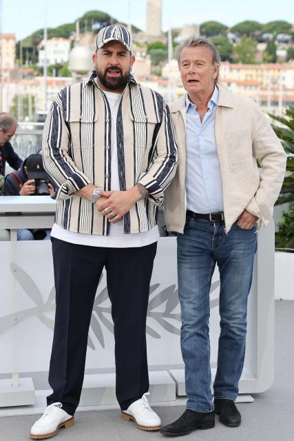 French actor Artus (L) and French actor Franck Dubosc pose during a photocall of the film "Les Caprices de l’Enfant Roi" at the 79th edition of the Cannes Film Festival in Cannes, southern France on May 15, 2026. (Photo by Thibaud MORITZ / AFP)
