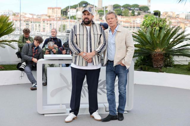 French actor Artus (L) and French actor Franck Dubosc pose during a photocall of the film "Les Caprices de l’Enfant Roi" at the 79th edition of the Cannes Film Festival in Cannes, southern France on May 15, 2026. (Photo by Thibaud MORITZ / AFP)