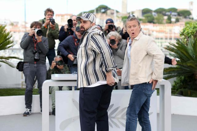 French actor Artus (L) and French actor Franck Dubosc pose during a photocall of the film "Les Caprices de l’Enfant Roi" at the 79th edition of the Cannes Film Festival in Cannes, southern France on May 15, 2026. (Photo by Thibaud MORITZ / AFP)