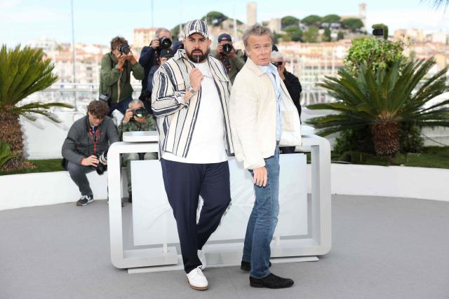 French actor Artus (L) and French actor Franck Dubosc pose during a photocall of the film "Les Caprices de l’Enfant Roi" at the 79th edition of the Cannes Film Festival in Cannes, southern France on May 15, 2026. (Photo by Thibaud MORITZ / AFP)