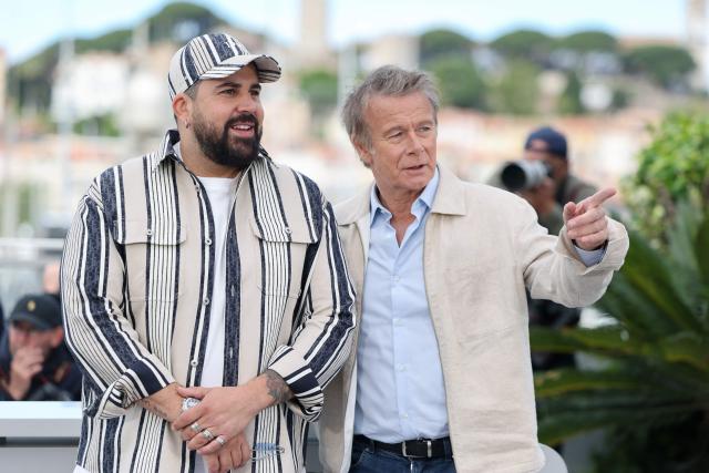 French actor Artus (L) and French actor Franck Dubosc pose during a photocall of the film "Les Caprices de l’Enfant Roi" at the 79th edition of the Cannes Film Festival in Cannes, southern France on May 15, 2026. (Photo by Thibaud MORITZ / AFP)