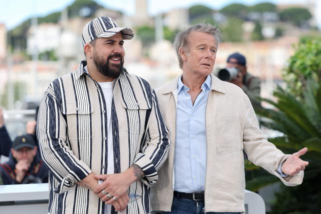 French actor Artus (L) and French actor Franck Dubosc pose during a photocall of the film "Les Caprices de l’Enfant Roi" at the 79th edition of the Cannes Film Festival in Cannes, southern France on May 15, 2026. (Photo by Thibaud MORITZ / AFP)