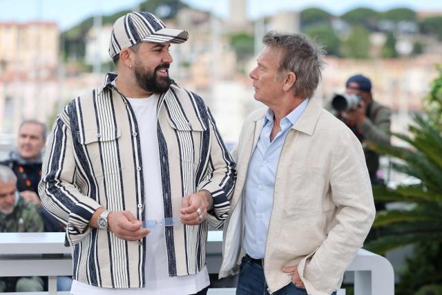 French actor Artus (L) and French actor Franck Dubosc pose during a photocall of the film "Les Caprices de l’Enfant Roi" at the 79th edition of the Cannes Film Festival in Cannes, southern France on May 15, 2026. (Photo by Thibaud MORITZ / AFP)