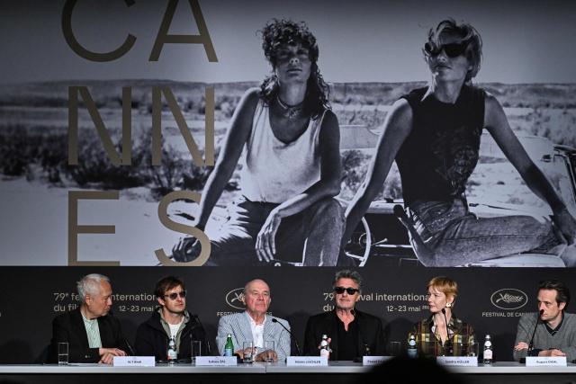 (From L) French scrinwriter, director and jounralist N.T Binh, Polish cinematographer Lukasz Zal, German actor Hanns Zischler, Polish director and screenwriter Pawel Pawlikowski, German actress Sandra Huller and German actor August Diehl attends a press conference for the film "Fatherland" at the 79th edition of the Cannes Film Festival in Cannes, southern France on May 15, 2026. (Photo by Julie SEBADELHA / AFP)