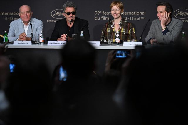 (From L) German actor Hanns Zischler, Polish director and screenwriter Pawel Pawlikowski, German actress Sandra Huller and German actor August Diehl attend a press conference for the film "Fatherland" at the 79th edition of the Cannes Film Festival in Cannes, southern France on May 15, 2026. (Photo by Julie SEBADELHA / AFP)