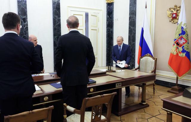 In this pool photograph distributed by the Russian state agency Sputnik, Russia's President Vladimir Putin chairs a meeting on economic issues in Moscow on May 15, 2026. (Photo by Mikhail METZEL / POOL / AFP)