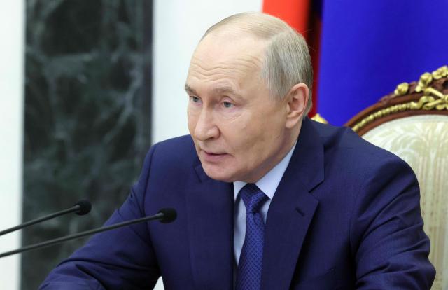 In this pool photograph distributed by the Russian state agency Sputnik, Russia's President Vladimir Putin chairs a meeting on economic issues in Moscow on May 15, 2026. (Photo by Mikhail METZEL / POOL / AFP)
