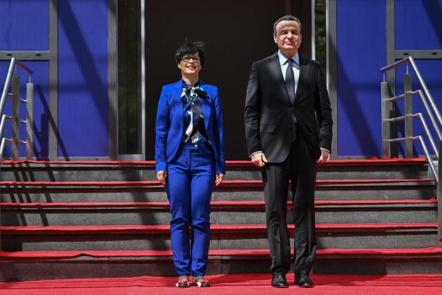Kosovo's Prime Minister Albin Kurti greets EU Commissioner for Enlargement Marta Kos (L) in Pristina on May 15, 2026. (Photo by Armend NIMANI / AFP)