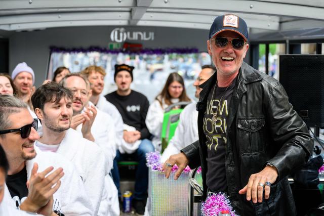 German DJ John Juergens greets members of the ESC Fan Club in Vienna, on  May 15, 2026, on the eve of the 2026 Eurovision Song Contest (ESC) final. (Photo by MAX SLOVENCIK / APA / AFP) / Austria OUT