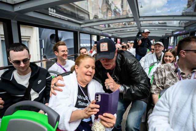 German DJ John Juergens greets members of the ESC Fan Club in Vienna, on  May 15, 2026, on the eve of the 2026 Eurovision Song Contest (ESC) final. (Photo by MAX SLOVENCIK / APA / AFP) / Austria OUT