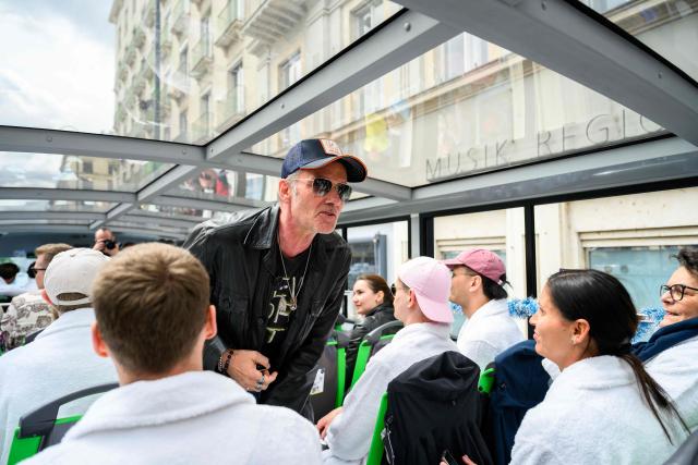German DJ John Juergens greets members of the ESC Fan Club in Vienna, on  May 15, 2026, on the eve of the 2026 Eurovision Song Contest (ESC) final. (Photo by MAX SLOVENCIK / APA / AFP) / Austria OUT