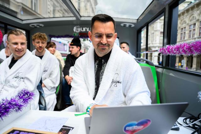 Members of the Eurovision Song Contest (ESC) Fan Club attend a bus tour in Vienna, on May 15, 2026, on the eve of the 2026 Eurovision Song Contest (ESC) final. (Photo by MAX SLOVENCIK / APA / AFP) / Austria OUT
