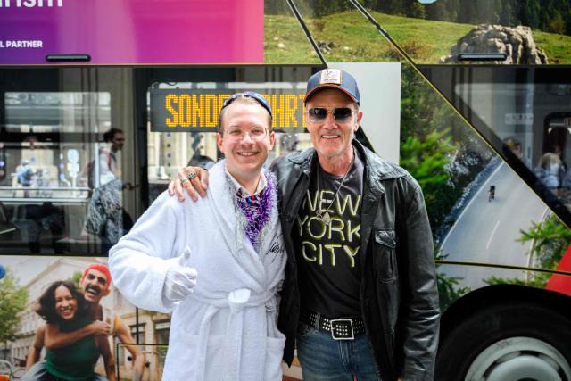 German DJ John Juergens poses with a member of the ESC Fan Club in Vienna, on  May 15, 2026, on the eve of the 2026 Eurovision Song Contest (ESC) final. (Photo by MAX SLOVENCIK / APA / AFP) / Austria OUT