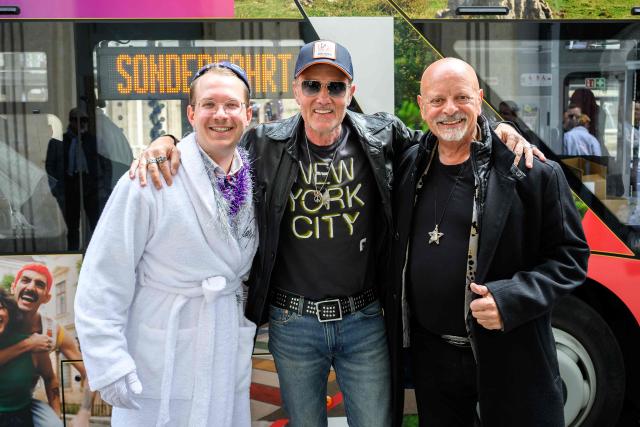 German DJ John Juergens (C) and Gerhard "Gary" Lux (R), Canadian-born Austrian singer, most famous for having represented Austria in the Eurovision Song Contest (ESC) six times, pose for medias in Vienna, on  May 15, 2026, as part of the arrival of members of the ESC Fan Club on the occasion of the 2026 Eurovision Song Contest (ESC). (Photo by MAX SLOVENCIK / APA / AFP) / Austria OUT